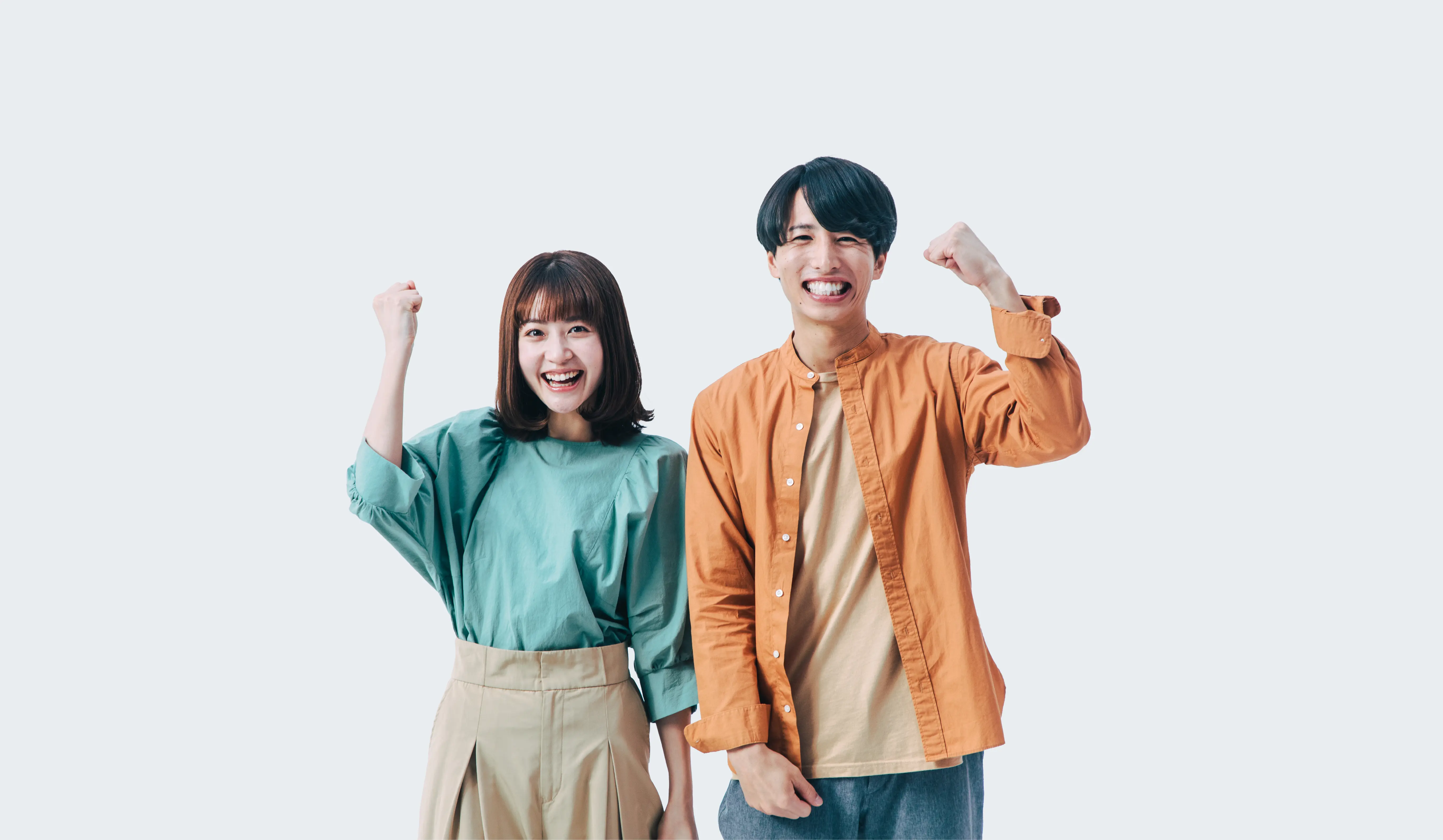 男女のガッツポーズ